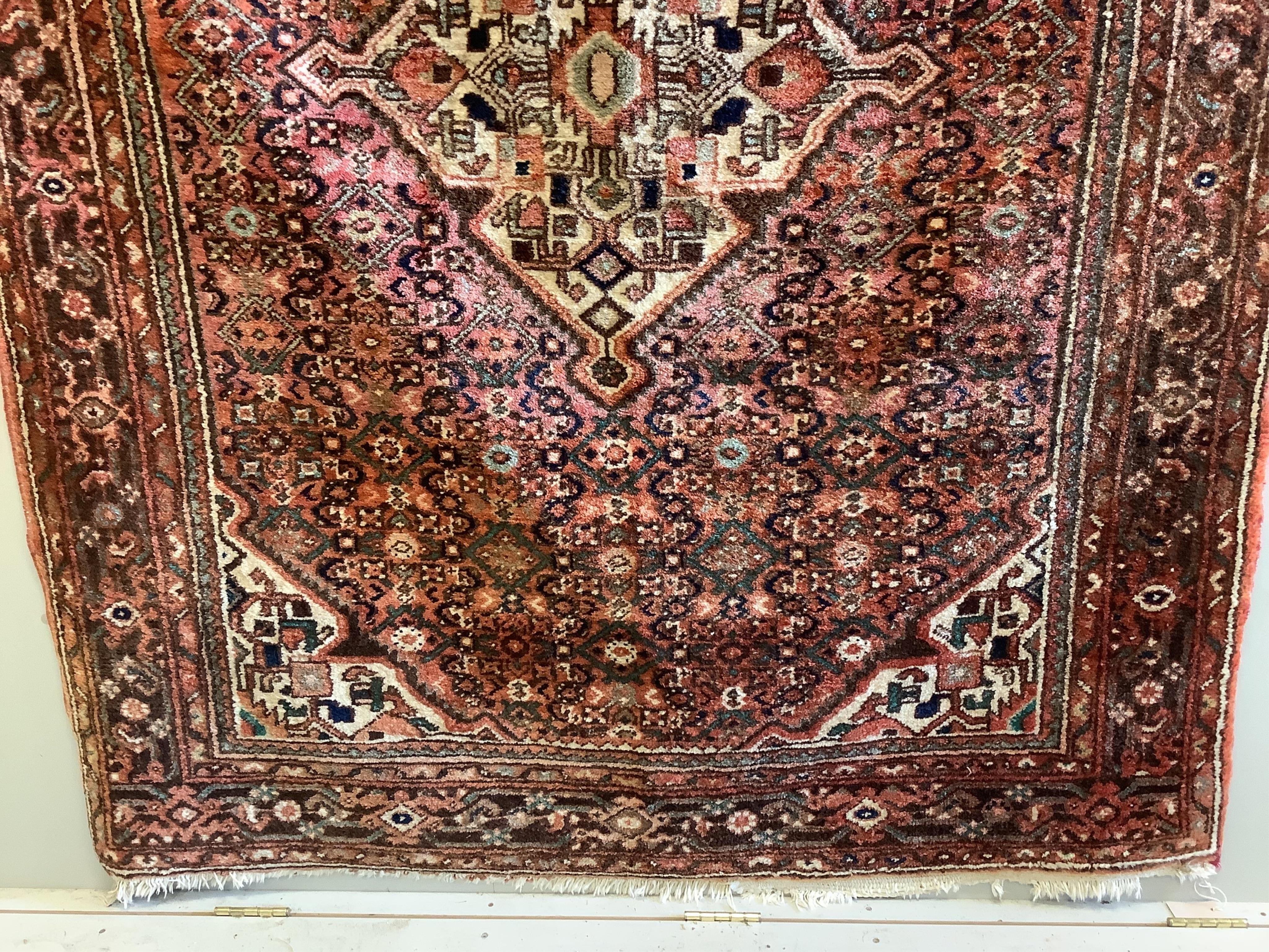 A Hamadan red ground rug, approx. 220 x 160cm. Condition - fair